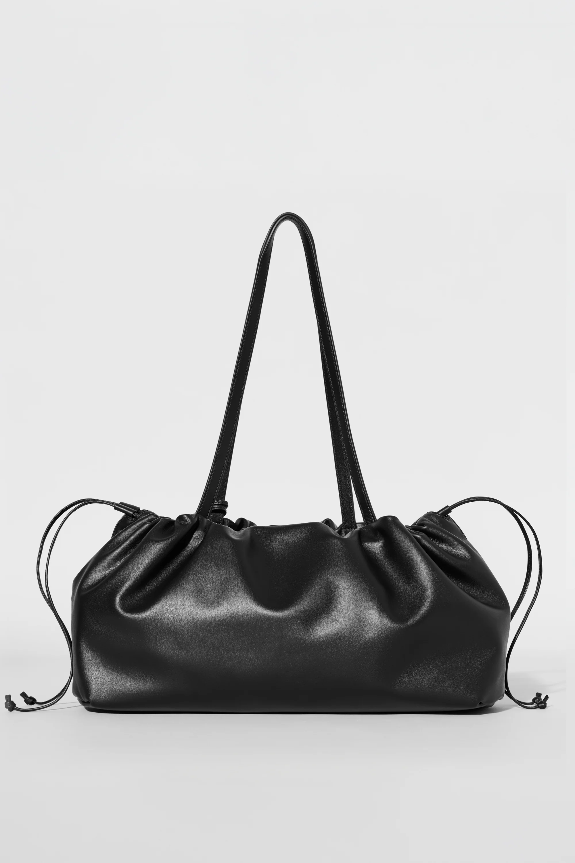 ALO Unwind Cinch Bag in Black Leather with Adjustable Drawstring