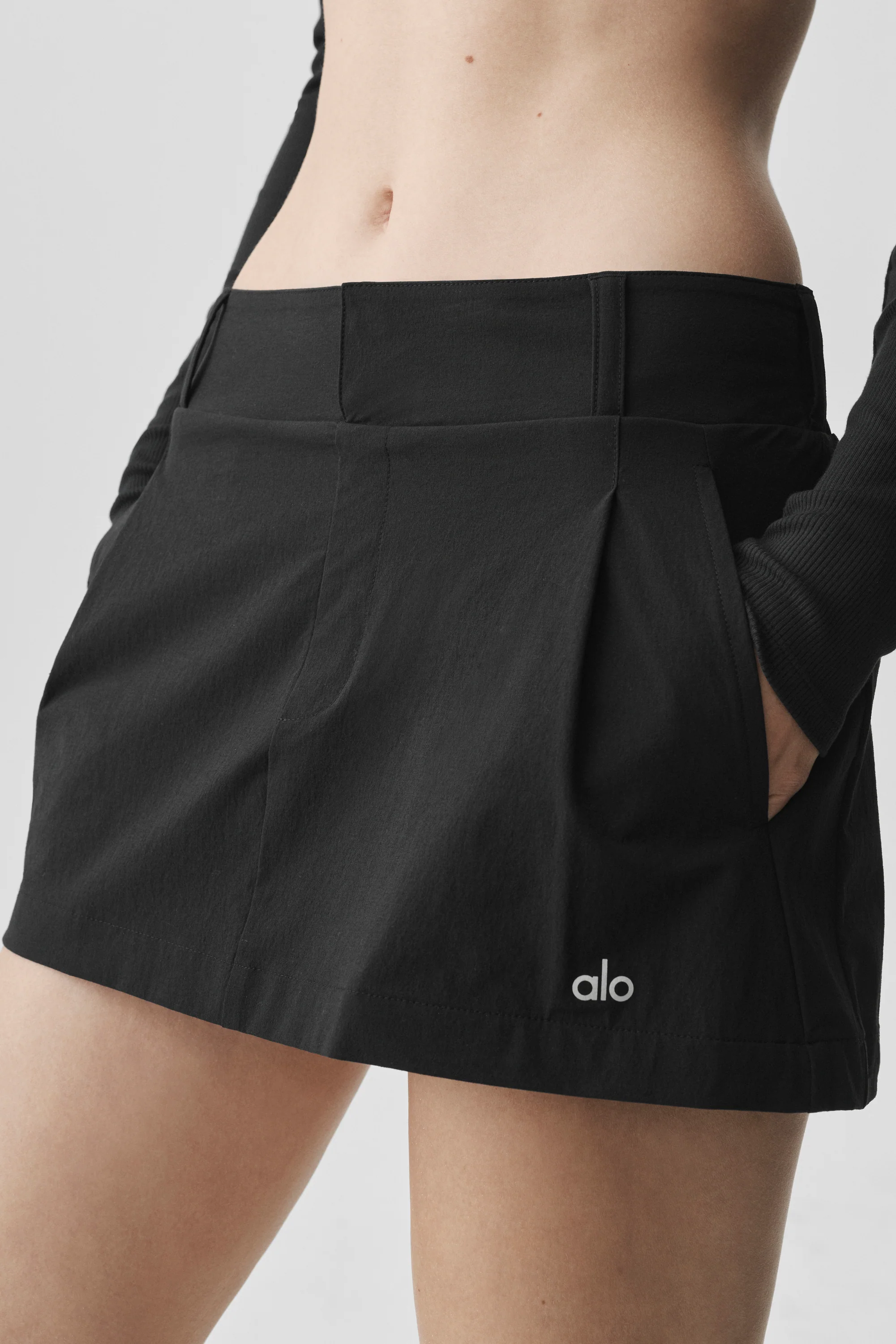 Fan Club Mini Skirt in Black with Built-In Shorts and Front Pleats