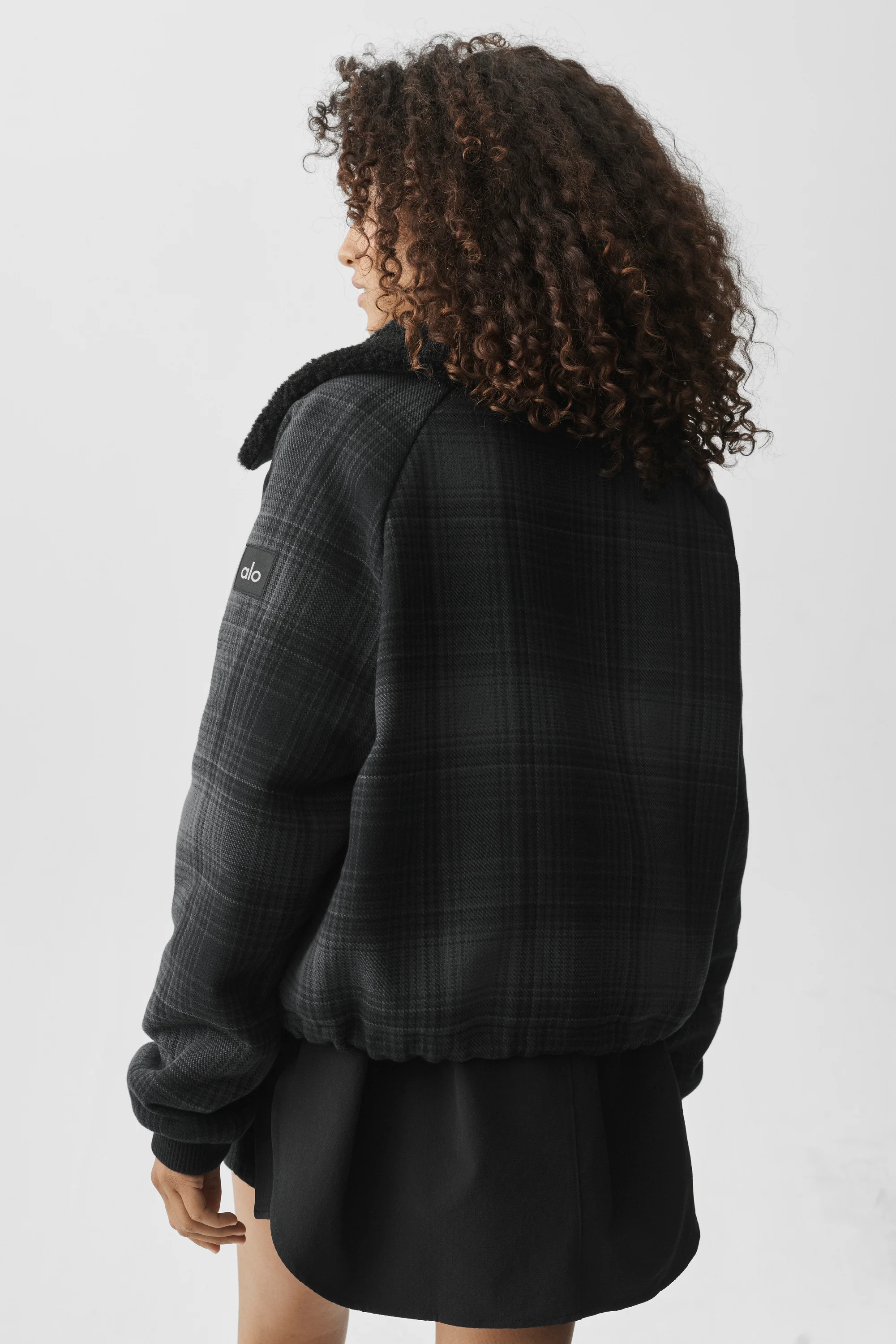 Plaid Alpine Meadow Jacket in Black Plaid by Alo Yoga