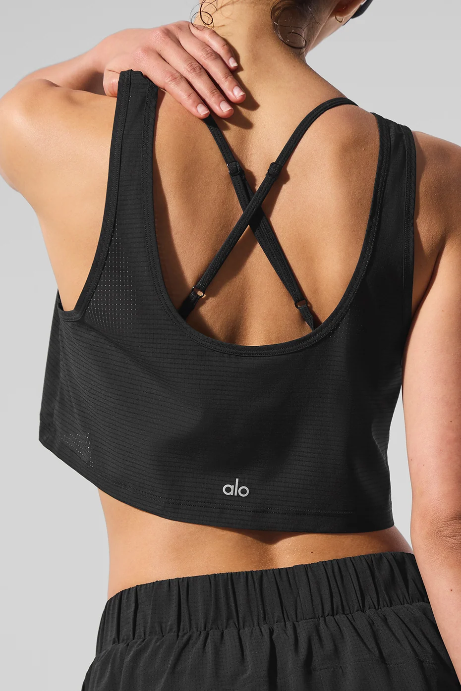 Top Sport Star cropped nero con taglio fluido