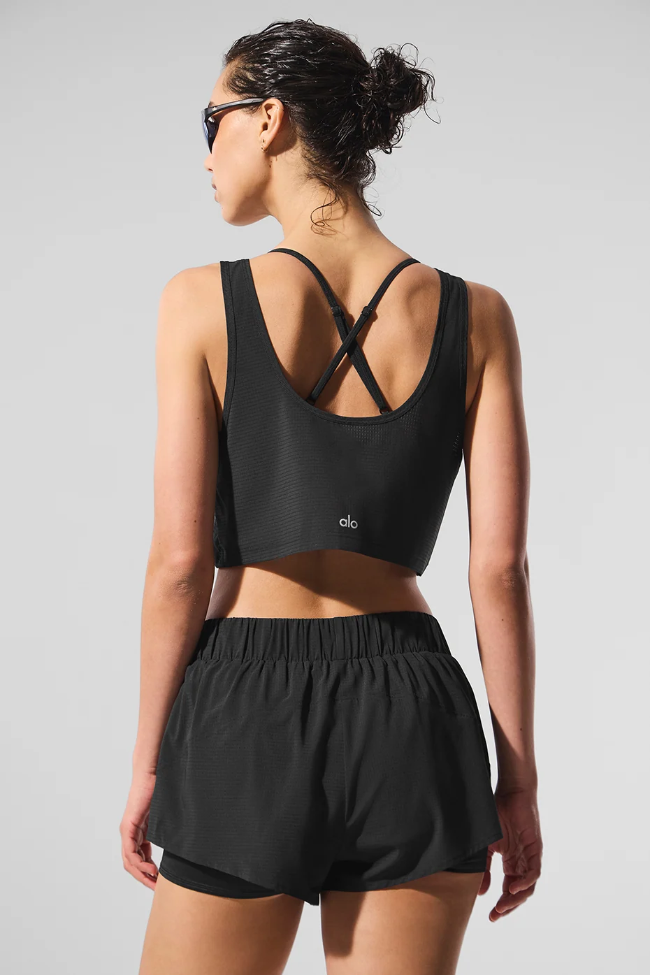 Top Sport Star cropped nero con taglio fluido