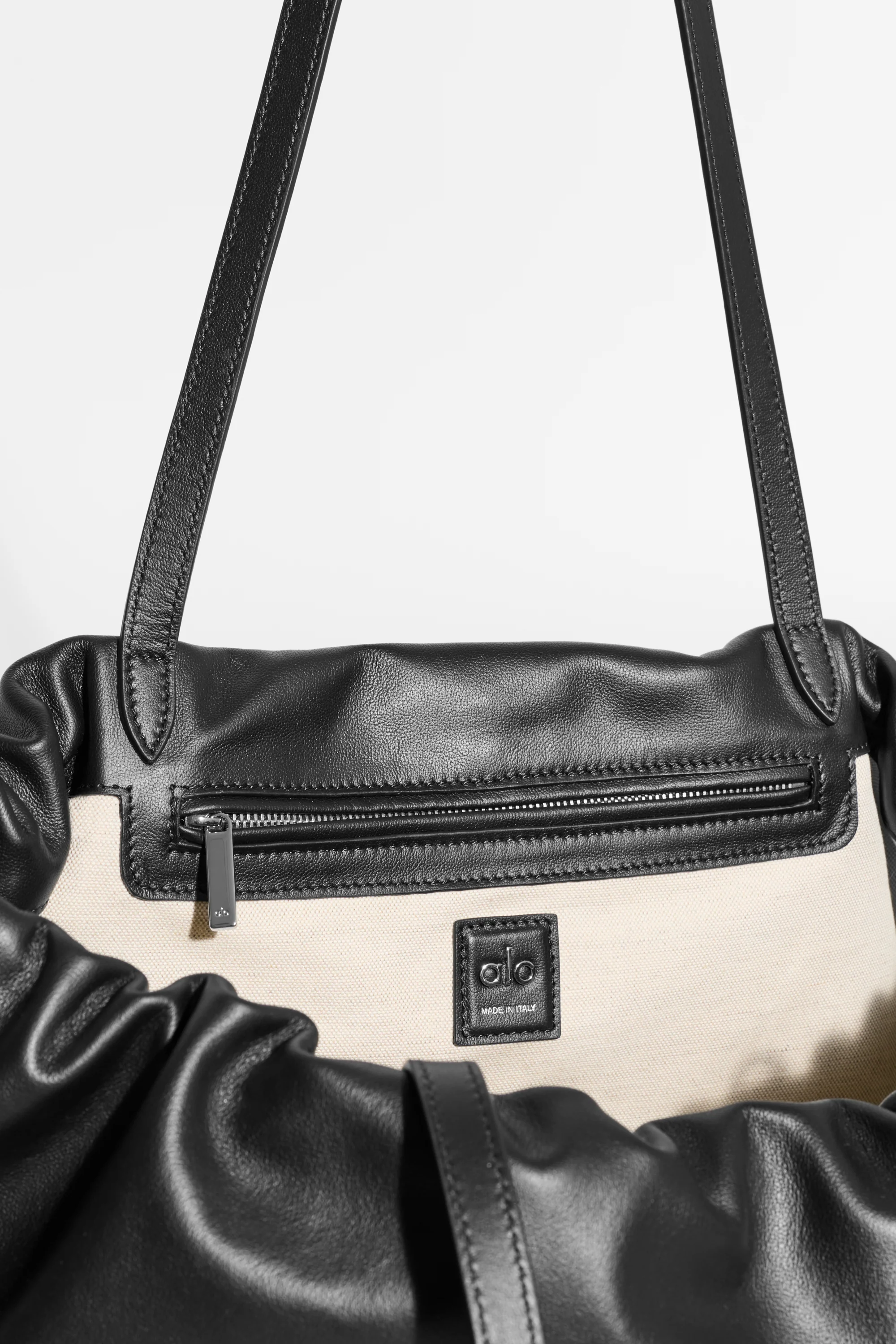 ALO Unwind Cinch Bag in Black Leather with Interior Zip Pocket